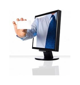 Cartoonish hand holding a blank business card protruding from a cartoon computer monitor